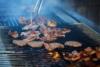 Entrecote : Close up of chef cooking meat on grill Stock Photo