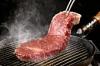 Sirloin steak on a table grill
